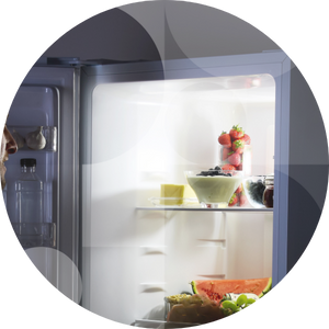 A fridge freezer in the dark.