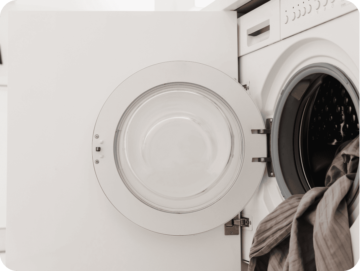 Washing machine door integrated into cupboard.