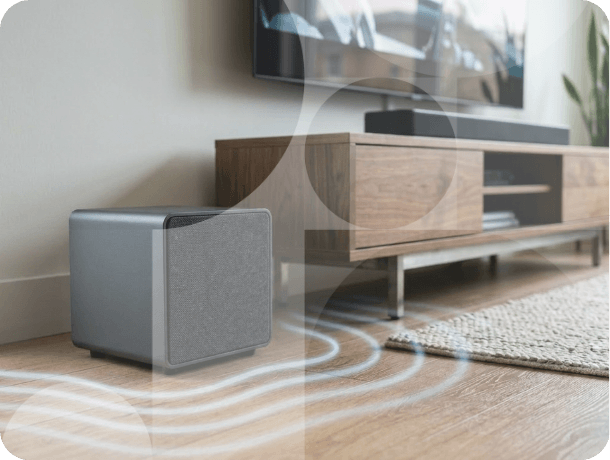 Living room with subwoofer creating immersive surround sound audio effect around seating area