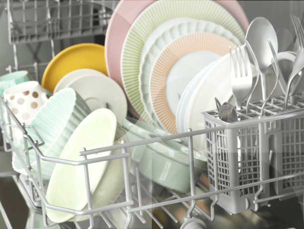 Close up of dishes in a dishwasher.