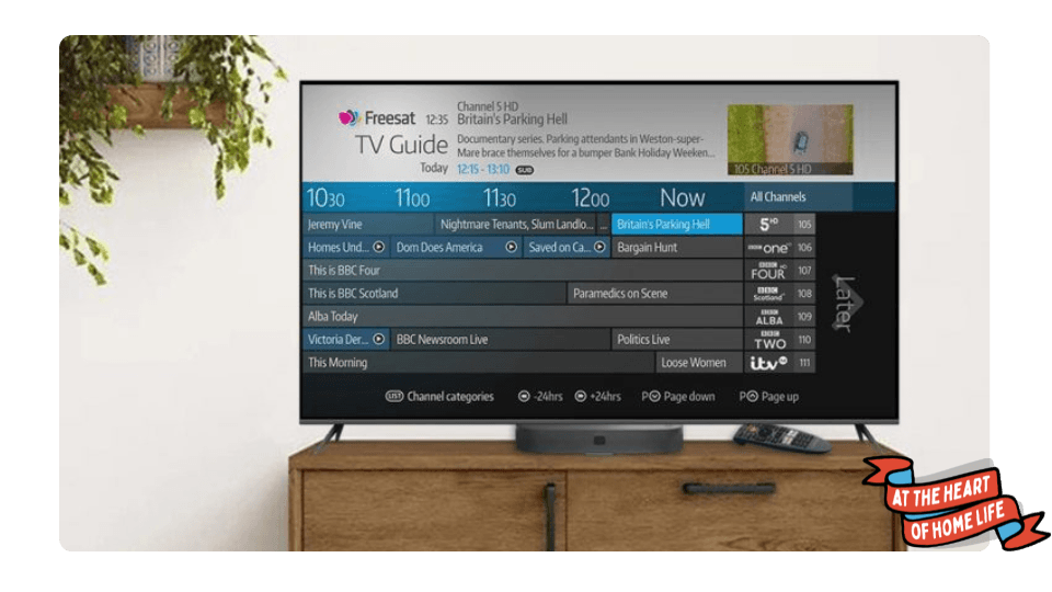 Freesat UHD-4X 500 Recordable 4K TV Box with remote on a TV stand