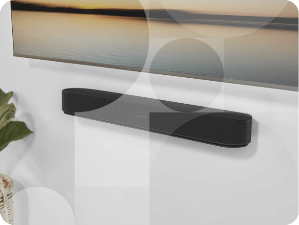Wall-mounted Sonos Beam Gen 2 Soundbar positioned below TV in a minimalist living room setup